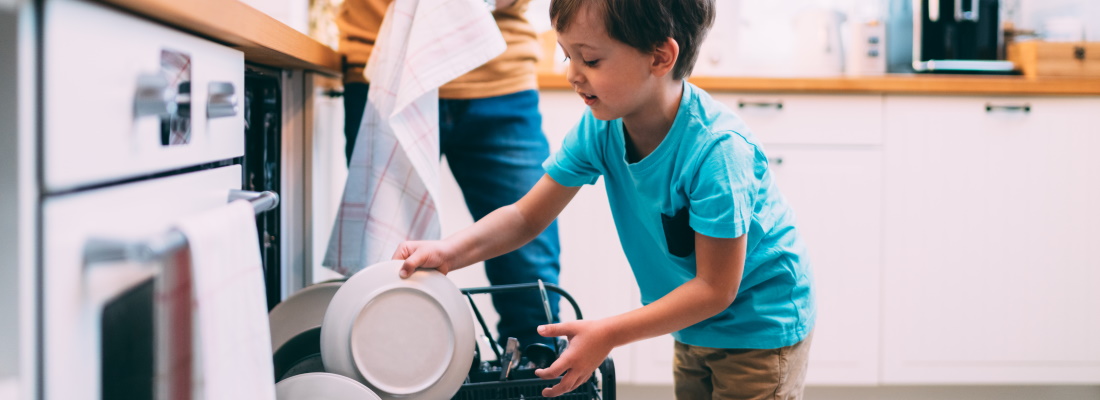 Child loading dishwasher